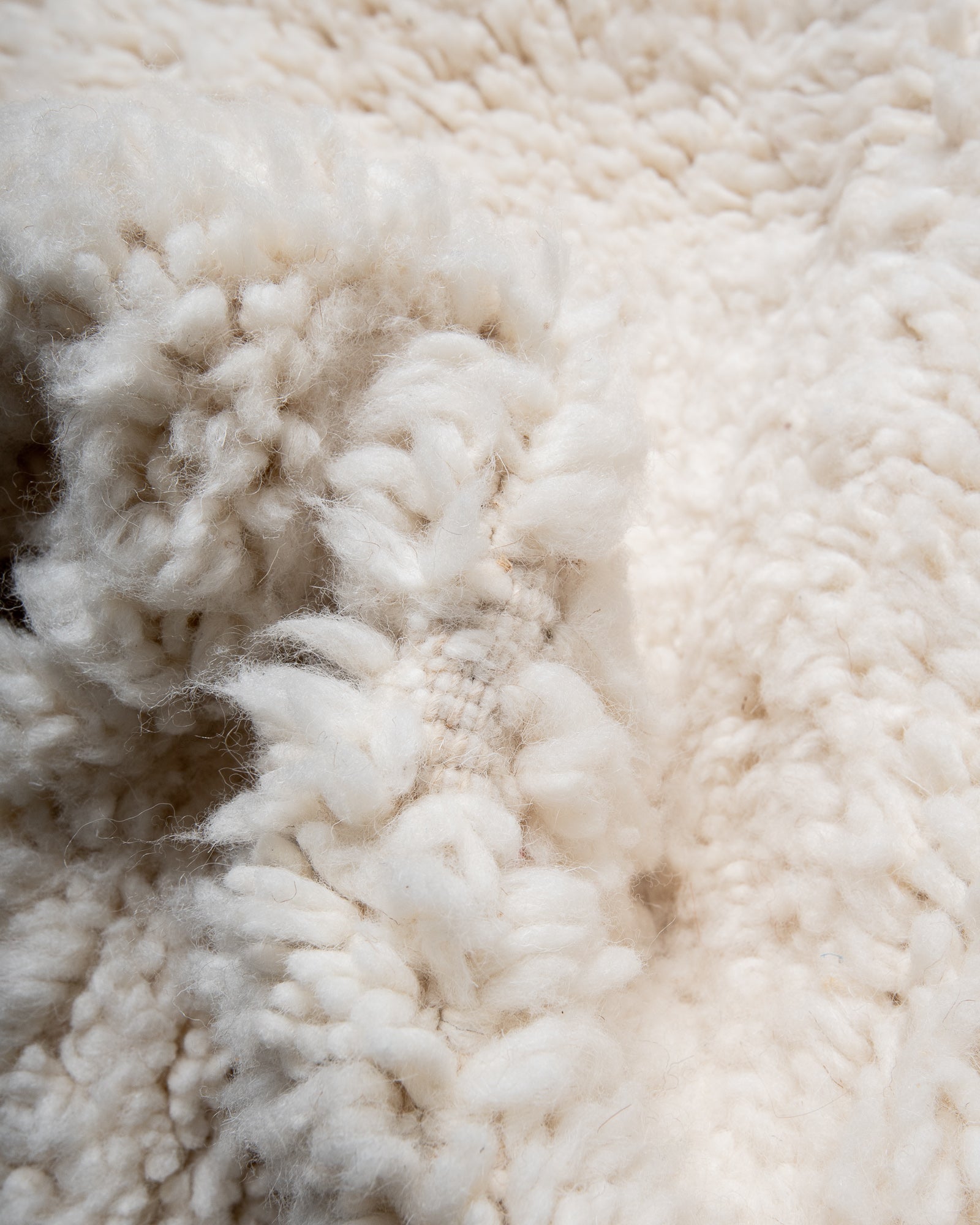 Modern, designer, handcrafted Berber rug from Morocco. Beniourain carpet with beautiful colours and patterns and fluffy wool texture.